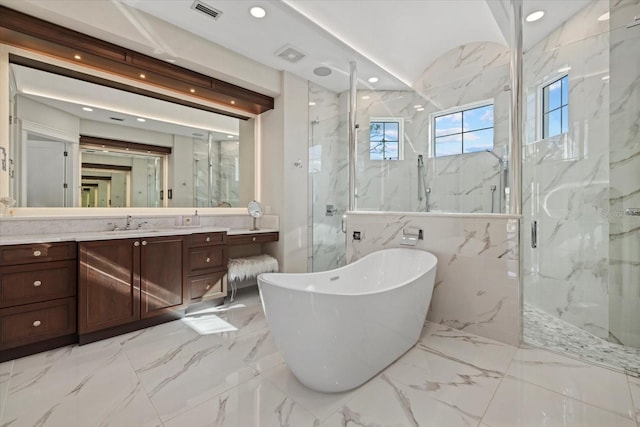 bathroom featuring tile walls, vanity, and shower with separate bathtub