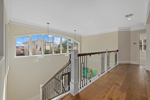 corridor featuring hardwood / wood-style flooring and crown molding