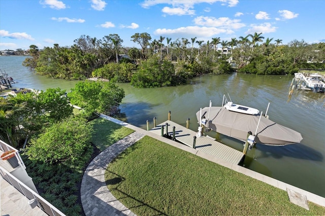 dock area with a yard and a water view