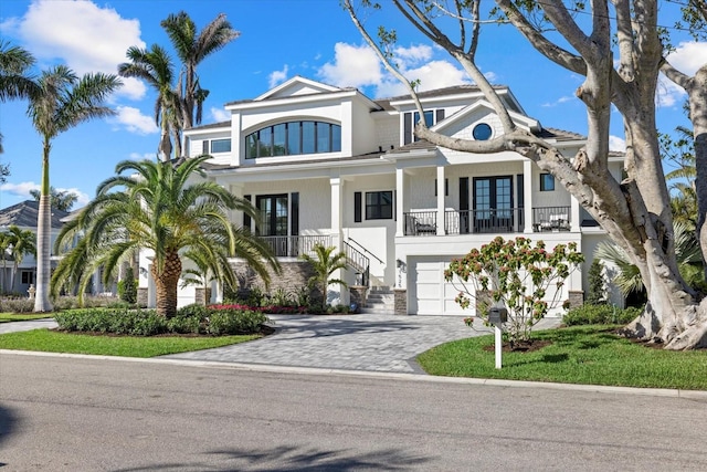 view of front facade with french doors and a garage