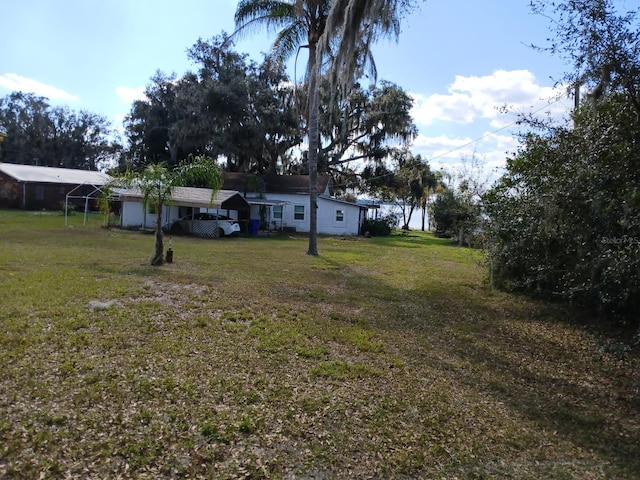 view of yard with a carport