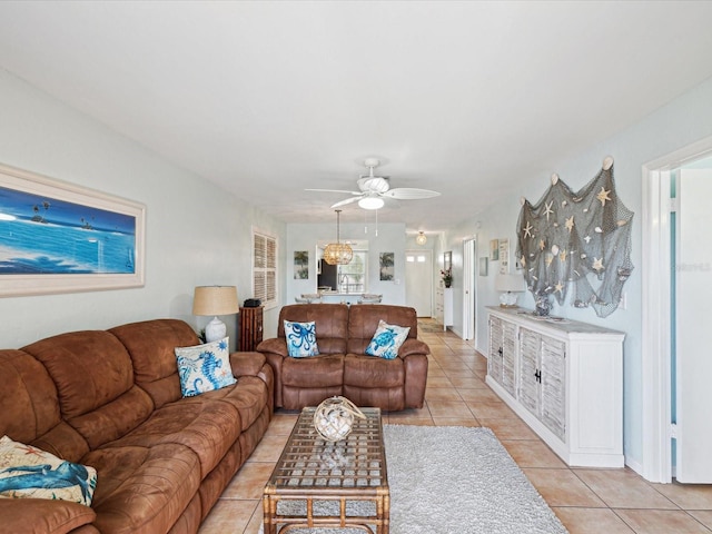 living area featuring light tile patterned floors and a ceiling fan