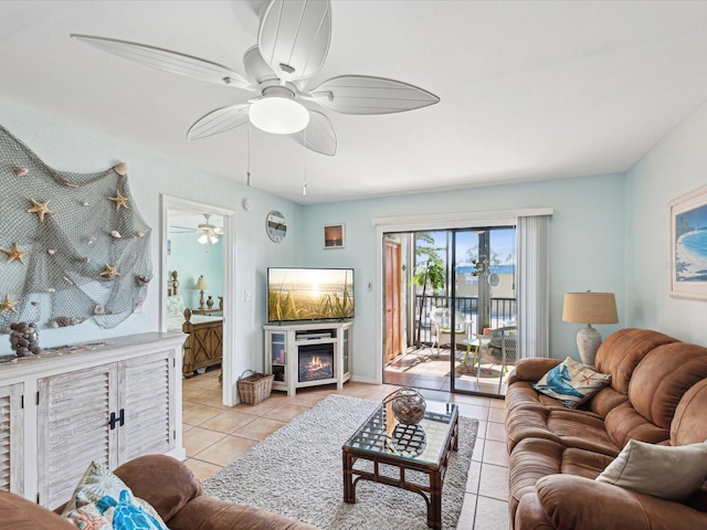 tiled living room featuring ceiling fan