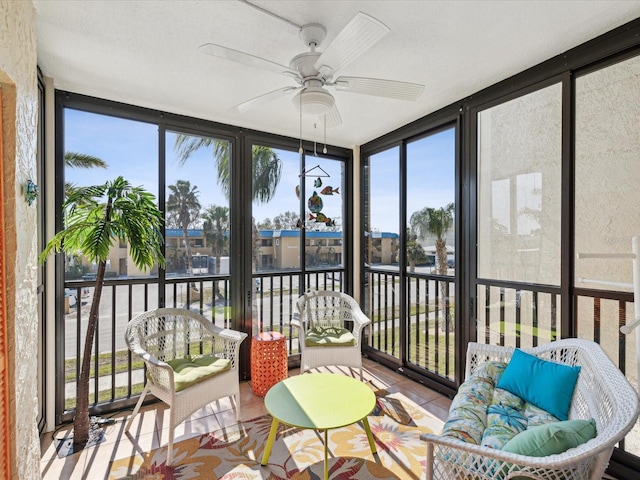 sunroom / solarium with a wealth of natural light and ceiling fan