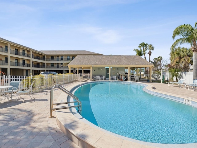 view of swimming pool with a patio