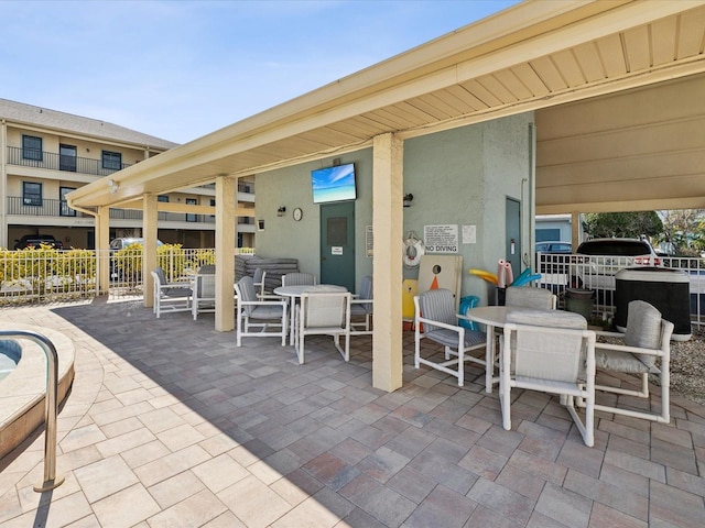 view of patio / terrace with outdoor dining space and fence