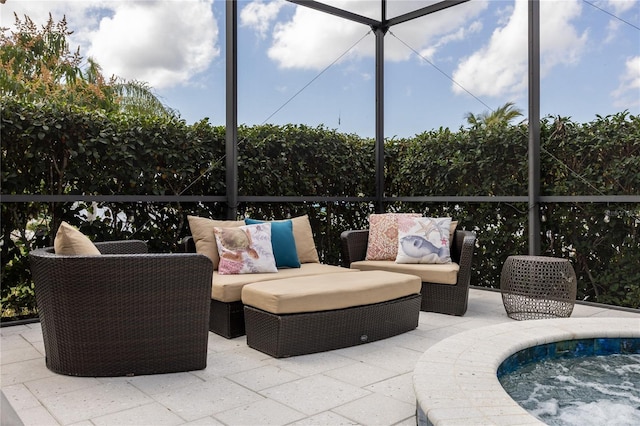 view of patio / terrace featuring a lanai