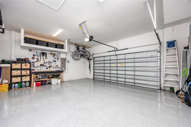 garage featuring a garage door opener and a workshop area