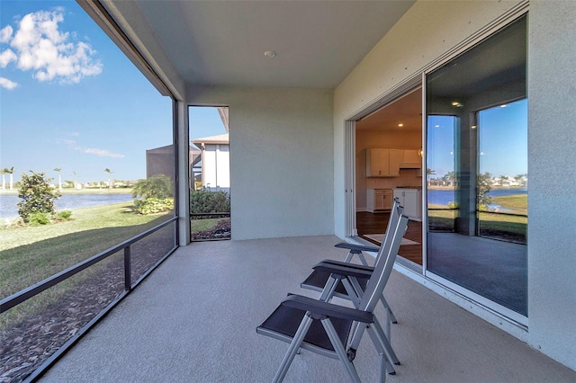 sunroom with a water view