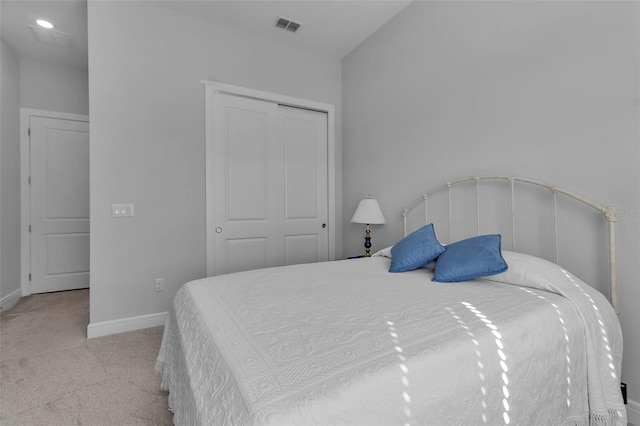 carpeted bedroom with a closet