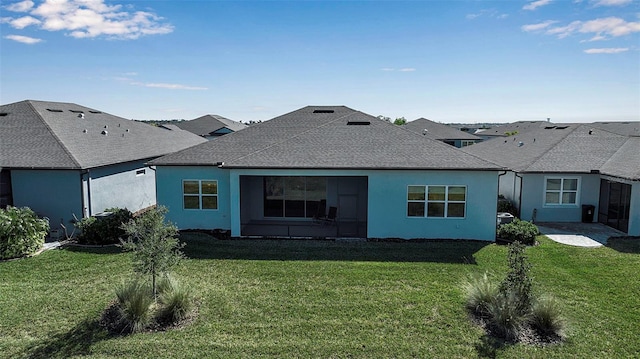 back of house featuring a yard