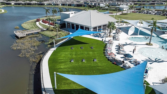 birds eye view of property featuring a water view