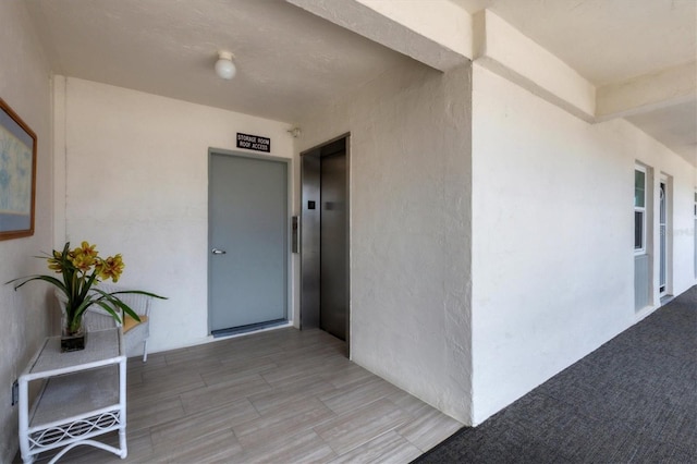 doorway to property featuring elevator