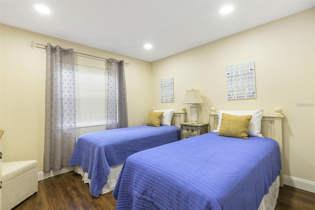 bedroom featuring dark hardwood / wood-style flooring