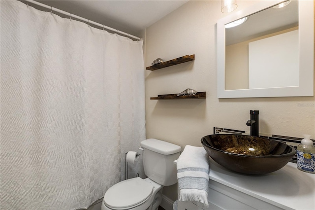 bathroom featuring sink and toilet