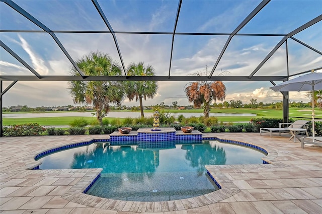 view of pool with a water view, a lanai, and a patio area