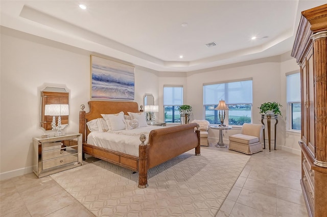 bedroom with a raised ceiling