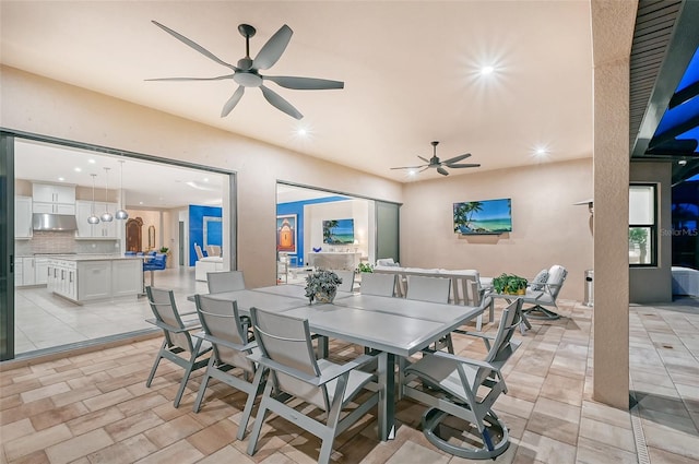 view of patio with ceiling fan and an outdoor kitchen