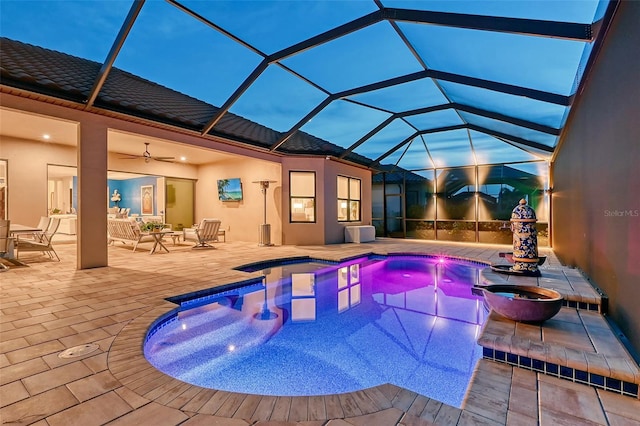 view of pool featuring a patio, a lanai, and ceiling fan