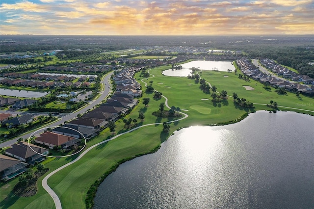 aerial view at dusk with a water view