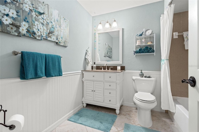 full bathroom featuring vanity, shower / bath combination with curtain, tile patterned floors, and toilet