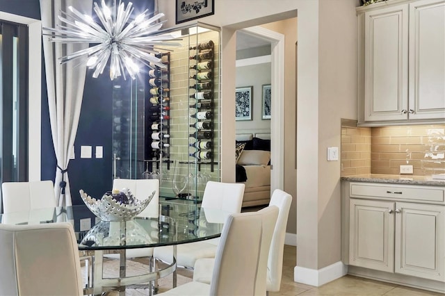 tiled dining area with a notable chandelier