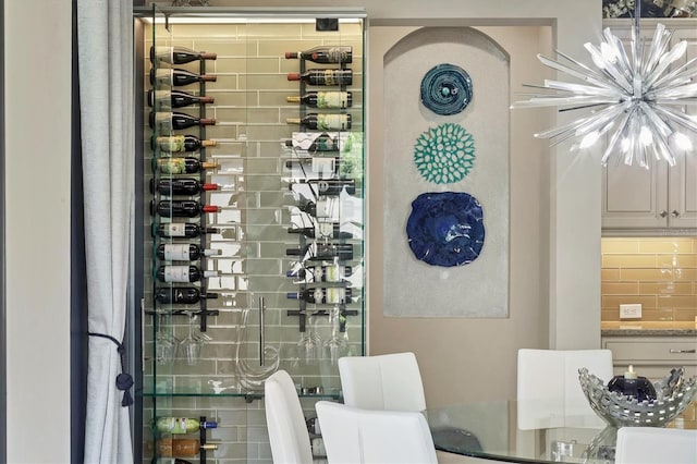 wine room with a chandelier