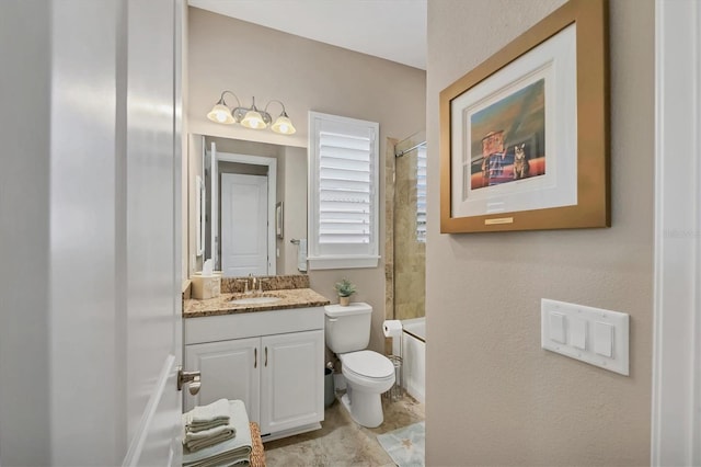 full bathroom featuring toilet, vanity, and tiled shower / bath combo