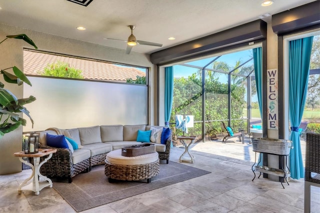 sunroom featuring ceiling fan