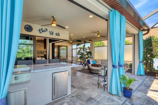 view of patio featuring an outdoor kitchen and an outdoor living space