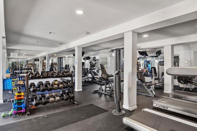 workout area featuring a textured ceiling