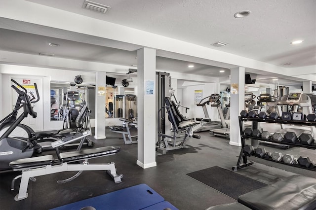 gym with a textured ceiling