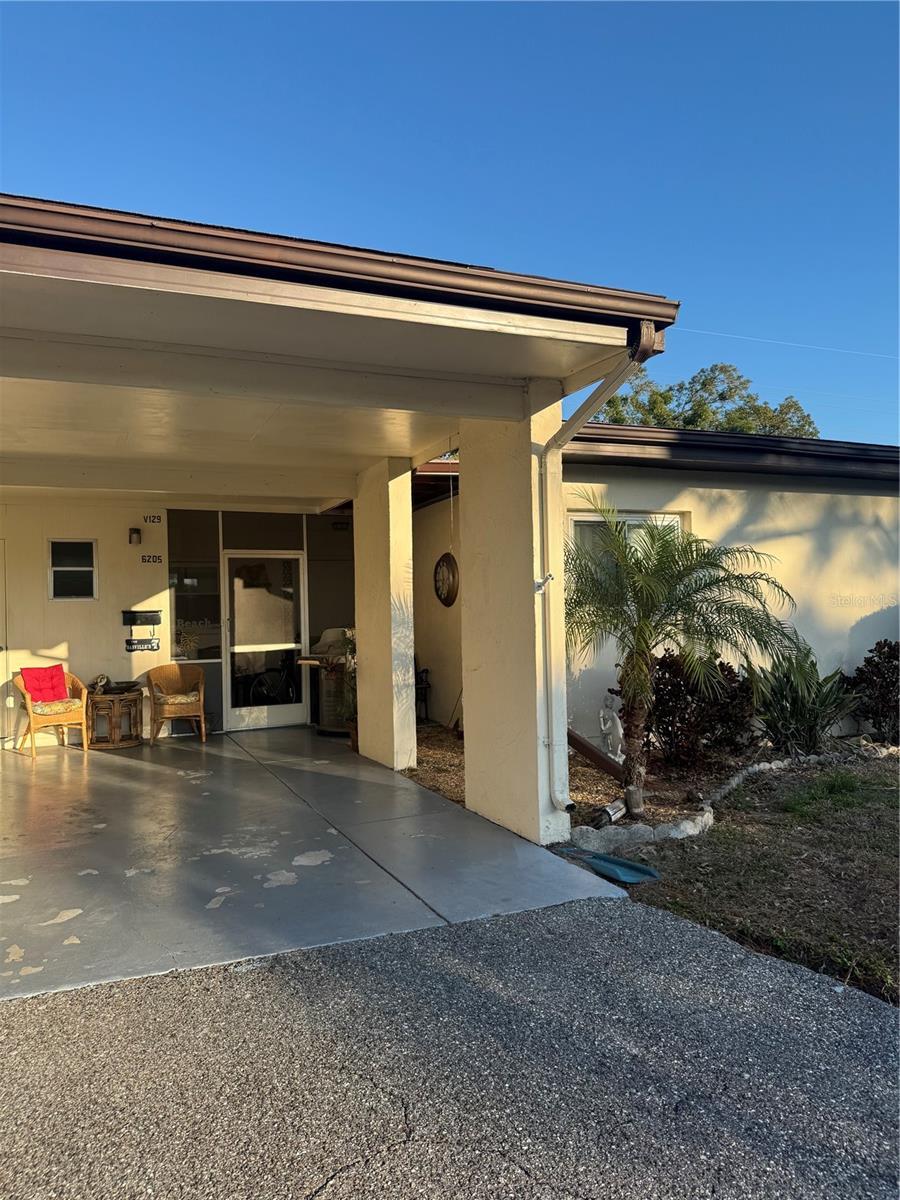 property entrance featuring a patio