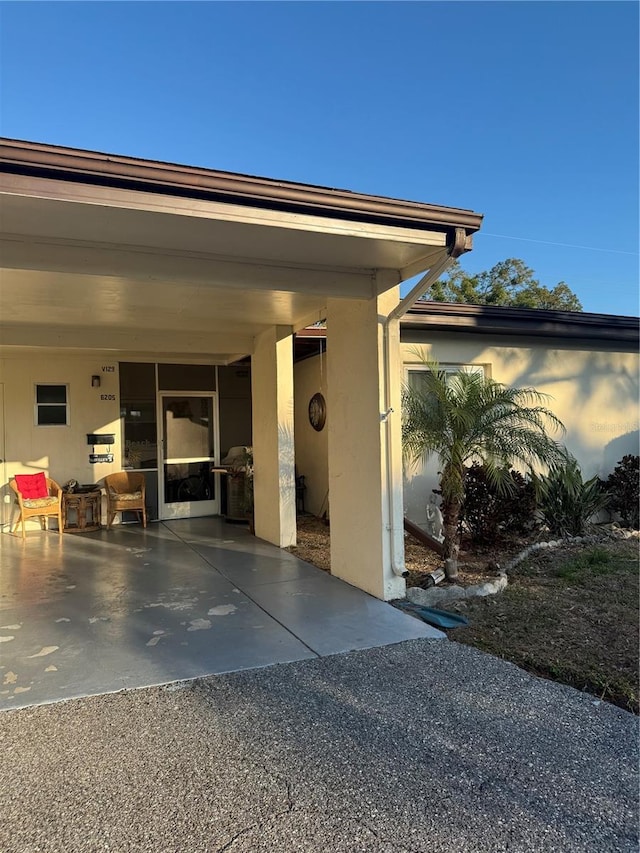 property entrance featuring a patio