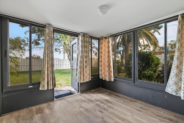 unfurnished sunroom featuring plenty of natural light