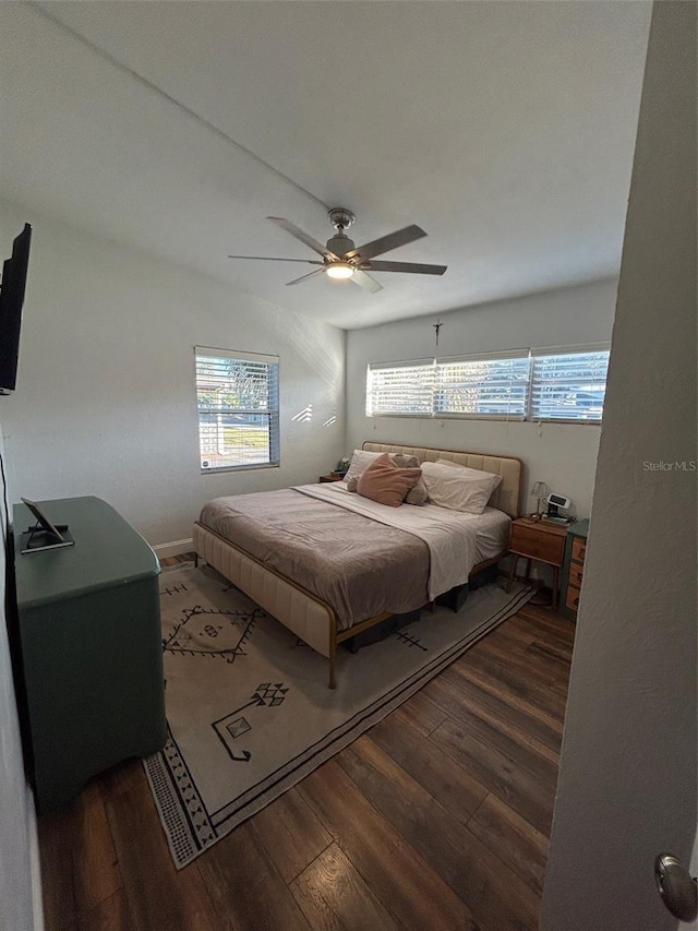 bedroom featuring dark hardwood / wood-style floors and ceiling fan