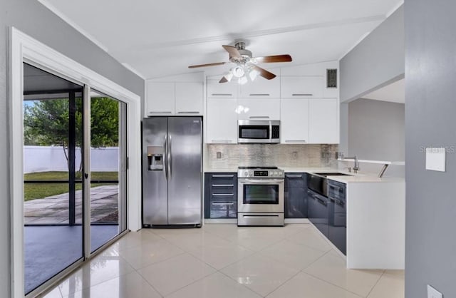 kitchen featuring white cabinetry, tasteful backsplash, stainless steel appliances, and light tile patterned flooring