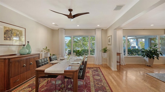 dining area with plenty of natural light, ceiling fan, and light wood-type flooring