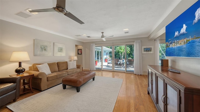 living room with ceiling fan and light wood-type flooring