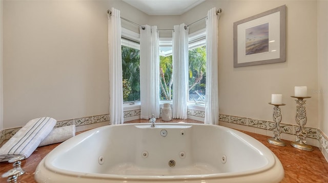 bathroom with a tub to relax in