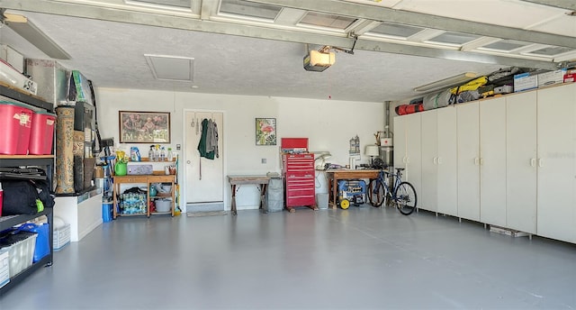 garage featuring a garage door opener and a workshop area