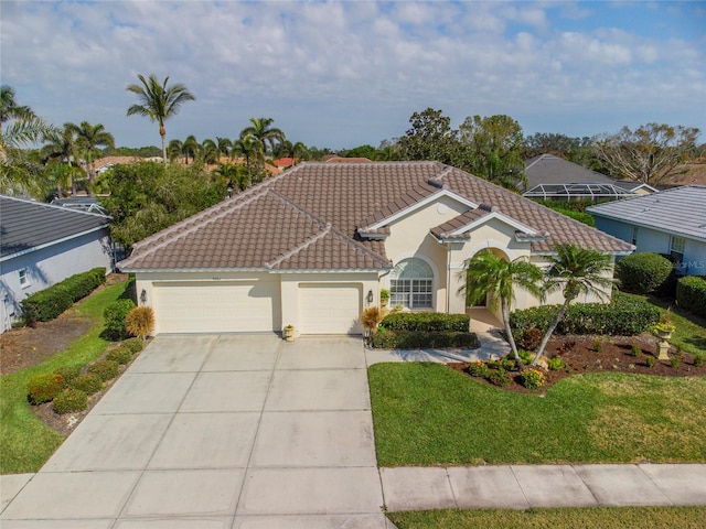 mediterranean / spanish house with a garage and a front yard