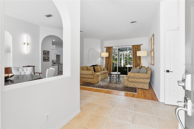 living room with light tile patterned flooring