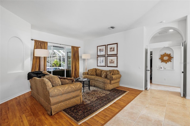 living room with light hardwood / wood-style flooring