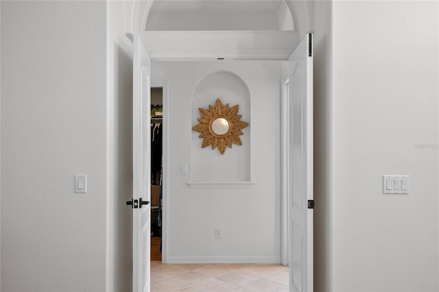 hall featuring light tile patterned floors