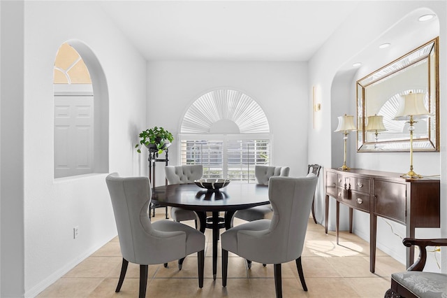 dining space featuring light tile patterned flooring