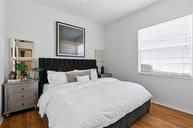 bedroom featuring hardwood / wood-style flooring and ceiling fan