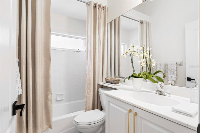 full bathroom featuring vanity, toilet, and shower / tub combo