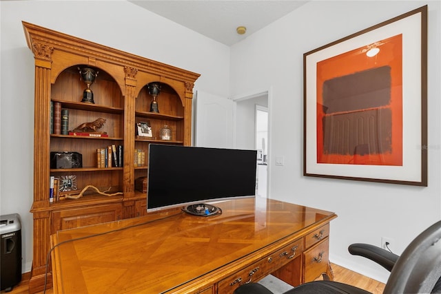 office space with hardwood / wood-style flooring