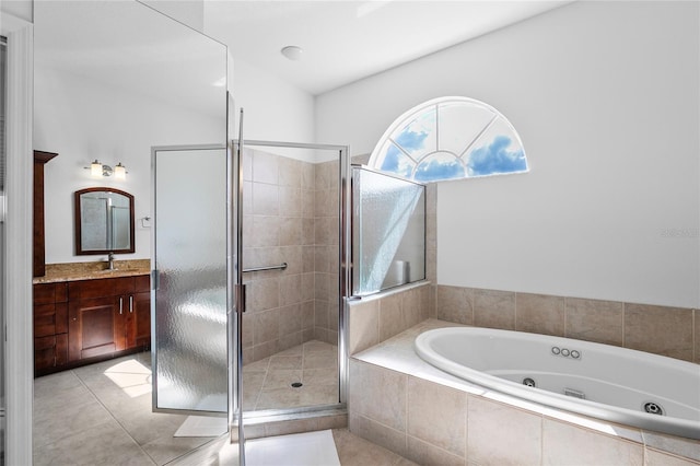 bathroom with tile patterned floors, vanity, and independent shower and bath